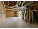 Unfinished basement space with exposed ceiling, ready for customization and renovation at 1017 Mill Creek Ne Mnr, Brookhaven, GA 30319