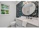 Stylish bathroom with marble countertop, modern fixtures, and decorative wallpaper at 1017 Mill Creek Ne Mnr, Brookhaven, GA 30319