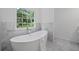 Relaxing bathroom featuring freestanding soaking tub and marble surround at 1017 Mill Creek Ne Mnr, Brookhaven, GA 30319