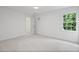 Bright bedroom with large window and closet, freshly painted with neutral carpet at 1017 Mill Creek Ne Mnr, Brookhaven, GA 30319