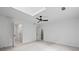 Spacious bedroom featuring neutral paint, ceiling fan, and carpeted floors at 1017 Mill Creek Ne Mnr, Brookhaven, GA 30319