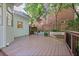 View of a wooden deck with a railing and landscaped backyard at 1017 Mill Creek Ne Mnr, Brookhaven, GA 30319
