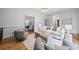 Open-concept living room featuring neutral decor, lots of natural light and an airy, inviting atmosphere at 1017 Mill Creek Ne Mnr, Brookhaven, GA 30319