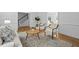 Serene living room featuring cozy seating and a view of the staircase at 1017 Mill Creek Ne Mnr, Brookhaven, GA 30319