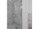 Elegant shower with glass enclosure and marble tile at 1017 Mill Creek Ne Mnr, Brookhaven, GA 30319
