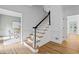 Elegant staircase with wood treads, white risers and beautiful contrasting dark stained handrail at 1017 Mill Creek Ne Mnr, Brookhaven, GA 30319