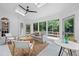 Bright sunroom with floor-to-ceiling windows, skylights, ceiling fan and stylish furniture at 1017 Mill Creek Ne Mnr, Brookhaven, GA 30319
