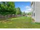 This expansive backyard features lush greenery and a well-maintained lawn at 2767 Nw Magnolia Creek Dr, Kennesaw, GA 30152