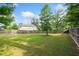 Expansive, fenced backyard with well-maintained lawn and mature trees at 2767 Nw Magnolia Creek Dr, Kennesaw, GA 30152