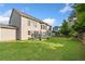 Large, fenced backyard with plenty of space for activities and a charming patio area at 2767 Nw Magnolia Creek Dr, Kennesaw, GA 30152