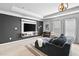 Comfortable sitting area in the main bedroom with a mounted TV and dark accent wall at 2767 Nw Magnolia Creek Dr, Kennesaw, GA 30152