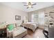 Bright bedroom features a sofa, shelving with sneaker collection, and large windows at 2767 Nw Magnolia Creek Dr, Kennesaw, GA 30152