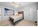 Cozy bedroom featuring a ceiling fan, comfortable bed, and charming decorative touches at 2767 Nw Magnolia Creek Dr, Kennesaw, GA 30152