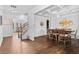 Formal dining room featuring hardwood floors, coffered ceilings, and wainscoting detail at 2767 Nw Magnolia Creek Dr, Kennesaw, GA 30152