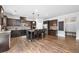A kitchen area showcasing dark cabinetry, a large island, hardwood floors, and stainless steel appliances at 2767 Nw Magnolia Creek Dr, Kennesaw, GA 30152