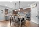 Well-lit kitchen with dark wood cabinets, stainless steel appliances, granite counters, and a central island at 2767 Nw Magnolia Creek Dr, Kennesaw, GA 30152