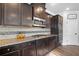 Beautiful kitchen featuring granite countertops, stainless steel appliances, and dark wood cabinetry at 2767 Nw Magnolia Creek Dr, Kennesaw, GA 30152