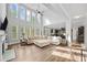 Open floor plan features large windows and a corner fireplace in the living room at 2767 Nw Magnolia Creek Dr, Kennesaw, GA 30152
