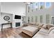 Bright living room with high ceilings, a fireplace, and many windows at 2767 Nw Magnolia Creek Dr, Kennesaw, GA 30152