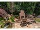 Tranquil backyard retreat features a waterfall, fireplace, and stone patio at 2941 Elizabeth Se St, Smyrna, GA 30080