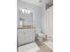 Well-lit bathroom features single vanity, shower with curtain and tile flooring at 2941 Elizabeth Se St, Smyrna, GA 30080