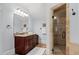 Well-lit bathroom with a granite vanity, walk-in shower, and decorative accents at 2941 Elizabeth Se St, Smyrna, GA 30080