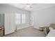 Light-filled bedroom featuring a ceiling fan, large closet, and neutral decor at 2941 Elizabeth Se St, Smyrna, GA 30080