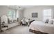 Cozy bedroom featuring a window seat, desk, and neutral décor at 2941 Elizabeth Se St, Smyrna, GA 30080