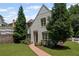 Beautifully landscaped front yard with mature trees and a brick pathway to the entrance at 2941 Elizabeth Se St, Smyrna, GA 30080