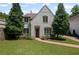 Charming two-story home with a lush lawn and a brick walkway at 2941 Elizabeth Se St, Smyrna, GA 30080