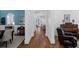 Elegant hallway with hardwood floors, archways, and views into dining and living areas at 2941 Elizabeth Se St, Smyrna, GA 30080