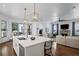 Spacious kitchen featuring a large island with seating and views of the breakfast nook and living area at 2941 Elizabeth Se St, Smyrna, GA 30080