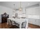 Bright kitchen featuring a large center island with seating, stainless steel appliances, and white cabinetry at 2941 Elizabeth Se St, Smyrna, GA 30080