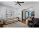 Comfortable living room with neutral tones, plantation shutters, and archway to other rooms at 2941 Elizabeth Se St, Smyrna, GA 30080