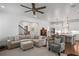 Comfortable living room with a plush sectional sofa, chair, and an open layout to the bright kitchen at 2941 Elizabeth Se St, Smyrna, GA 30080