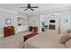Expansive primary bedroom featuring built-in shelves, an exercise area, and neutral décor at 2941 Elizabeth Se St, Smyrna, GA 30080