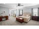 Spacious main bedroom with an attached sitting room, neutral tones, and natural light at 2941 Elizabeth Se St, Smyrna, GA 30080