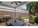 Outdoor kitchen and patio with a grill and seating near a retaining wall at 2941 Elizabeth Se St, Smyrna, GA 30080