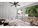 Relaxing screened porch with comfortable seating and decorative Eiffel Tower at 2941 Elizabeth Se St, Smyrna, GA 30080