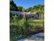 A statue accents the gate, adding to this home's classic appeal at 435 Johnson Ferry Nw Rd, Atlanta, GA 30328