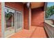 An exterior balcony with red cedar shake siding and a tile floor at 150 Henderson Farm Dr, Woodstock, GA 30188