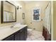 Full bathroom features tile flooring, sink, vanity and shower with curtain at 150 Henderson Farm Dr, Woodstock, GA 30188