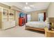 Spacious bedroom featuring a ceiling fan, a built-in bookcase, and lots of natural light at 150 Henderson Farm Dr, Woodstock, GA 30188