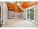 A spacious bedroom features a wood ceiling, sliding glass door, and carpeted floors at 150 Henderson Farm Dr, Woodstock, GA 30188