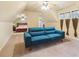 Bedroom sitting area with modern blue couch, window and shared access to bedroom with bed at 150 Henderson Farm Dr, Woodstock, GA 30188
