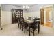 Elegant dining room with a large table, china cabinet, and detailed trim work at 150 Henderson Farm Dr, Woodstock, GA 30188
