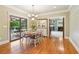Dining room with access to back patio and pool; fireplace in the adjacent room at 150 Henderson Farm Dr, Woodstock, GA 30188