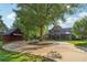 Estate view showcasing the main house, the outbuilding, circular driveway and lush landscaping at 150 Henderson Farm Dr, Woodstock, GA 30188