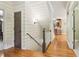 Bright hallway features hardwood floors, shiplap walls, and access to other rooms at 150 Henderson Farm Dr, Woodstock, GA 30188