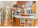 Modern kitchen with stainless steel appliances, wood cabinets, and a butcher block island at 150 Henderson Farm Dr, Woodstock, GA 30188
